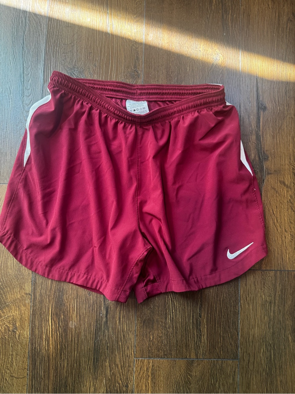 Nike Women's Maroon Athletic Shorts with White Swoosh